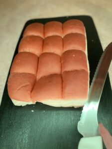 Slicing King's Hawaiian Rolls with Bread Knife