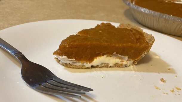 Slice of Double Layer Pumpkin Pie on a Plate